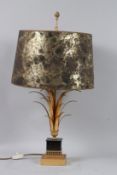 A GOOD TABLE LAMP in the manner of MAISON CHARLES with shade. 25ins high.
