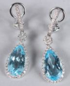A PAIR OF 18CT WHITE GOLD, BLUE TOPAZ AND DIAMOND PEAR SHAPED EARRINGS.