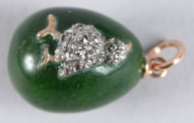 A 14CT GOLD RUSSIAN JADE AND DIAMOND CHICK PENDANT.