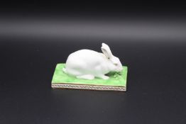 A DERBY PORCELAIN RABBIT on a rectangular base, Circa 1820. 4.5ins long. Provenance:MERCURY