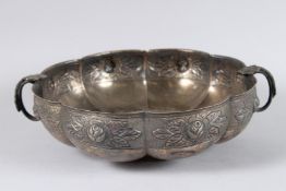 A MEXICAN SILVER SHAPED TWO HANDLED BOWL stamped SANDBORNS, MEXICO. 22ozs.