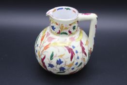 AN ISLAMIC JUG. 5ins high.