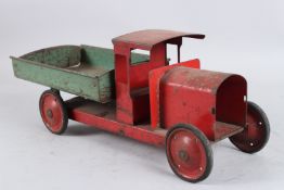 A TINPLATE TIP UP LORRY. 44cms long.