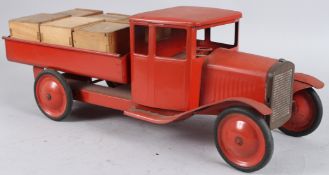 A TRI-ANG RED TIPPER TRUCK. 50cms long.