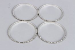 A STERLING SILVER FOUR BAND SET OF BANGLES.