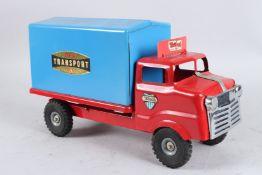 A TRI-ANG RED AND BLUE TRANSPORTER. 35cms long.