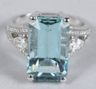AN 18CT WHITE GOLD, AQUAMARINE AND DIAMOND RING, the aquamarine 7.7cts.