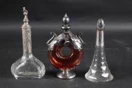 THREE SILVER MOUNTED SCENT BOTTLES.