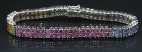 A VERY GOOD 18CT WHITE GOLD DOUBLE ROW OF SAPPHIRE STONES BRACELET, various colours. 27grams, 8ins