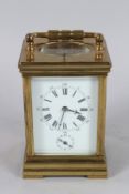 A FRENCH BRASS REPEATER CARRIAGE CLOCK. 4.5ins high.