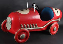 A TRI-ANG No. 9 RED PEDAL SPORTS CAR. 120cms long.