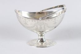 A VICTORIAN ENGRAVED BOAT SHAPED SUGAR BASIN. Sheffield 1876.