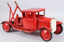 A TRI-ANG RED TOW TRUCK. 45cms long.