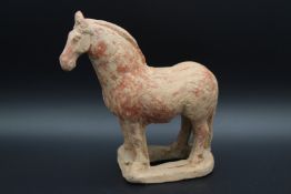 AN ANCIENT TERRACOTTA HORSE. 5ins high.