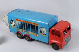A TRI-ANG CIRCUS VAN AND TRAILER. Blue with red cab. 60cms long.