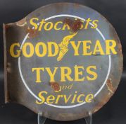 A VINTAGE GOODYEAR TYRES DOUBLE-SIDED CIRCULAR ENAMEL SIGN with Goodyear logo of the Flying Shoe.