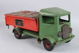 A TRI-ANG GREEN AND RED TRANSPORTER. 45cms long.