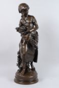 MATHURIN MOREAU 1822 - 1912. A FINE BRONZE OF A YOUNG GIRL carrying a bird's nest and flowers in her