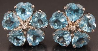 A SUPERB PAIR OF 18CT WHITE GOLD TOPAZ EAR CLIPS, set with five topaz stones and small diamonds.