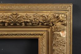 GILT PICTURE FRAME decorated with flowers and foliage recess 44.8 X 34.8cm overall 75 x 65cm