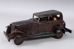 AN ANGLO INDIAN CARVED WOODEN CAR. Old car 13.5ins high
