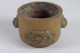 A CHINESE BRONZE CENSER decorated with dragon and phoenix, with four character mark.