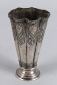 AN INDIAN WHITE METAL VASE. 5ins high