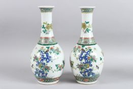 A PAIR OF CHINESE FAMILLE ROSE PORCELAIN BOTTLE VASES painted with birds and flowers Six character