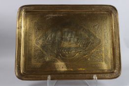 A 19TH CENTURY PERSIAN HAND CARVED BRASS RECTANGULAR TRAY. 20ins wide