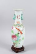 A CHINESE PORCELAIN VASE painted with birds and calligraphy 30cm high on a wooden base