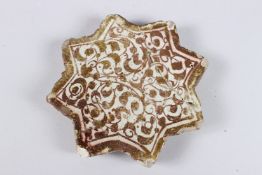 A FINE 13TH - 14TH CENTURY PERSIAN ILKHANID KASHAN COPPER LUSTRE GLAZED STAR TILE. 5ins x 5ins