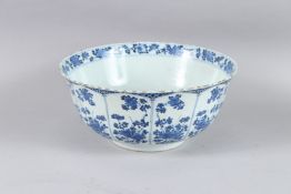 A VERY GOOD 18TH CENTURY BLUE AND WHITE CIRCULAR BOWL the centre with a basket of flowers, the sides