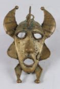 AN AFRICAN BRASS MASK