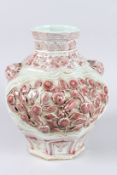 A CHINESE RED AND WHITE PORCELAIN VASE. 11ins high