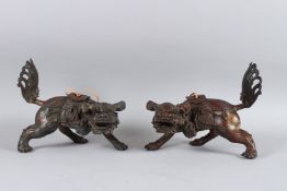 A PAIR OF GILT BRONZE LIONS 24cm long