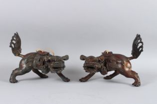 A PAIR OF GILT BRONZE LIONS 24cm long