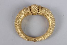 A FINE 19TH CENTURY SOUTH INDIAN GILT METAL BANGLE with dragon heads