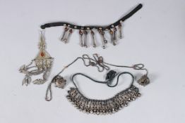 A COLLECTION OF FOUR CENTRAL ASIAN TURKMEN AND BUKHARA SILVER JEWELLERY 328gms.