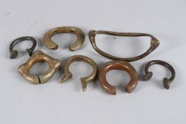 SEVEN AFRICAN BRASS BRACELETS AND