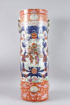 A VERY GOOD IMARI CIRCULAR STICK STAND with applied handles and painted with various dragons etc..