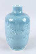 A CHINESE GREY POTTERY VASE decorated with flowers. Square blue mark. 11ins high