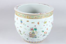 A GOOD CHINESE PORCELAIN CIRCULAR PLANTER painted with flowers and emblems. 12ins high x 15ins