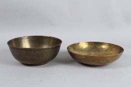 TWO PERSIAN QAJAR HAND CARVED CIRCULAR BRASS BOWLS. 9ins diameter