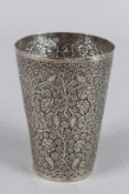 AN INDIAN WHITE METAL BEAKER. 5ins high