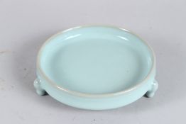 A CHINESE CELADON TRIPLE FOOT BOWL