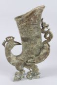 A BROWN ARCHAIC BIRD VASE. 12ins high