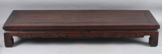 A CHINESE LOW REDWOOD TABLE