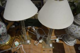 A pair of stylish glass table lamps.