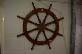 A reproduction ships wheel.