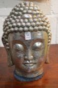 A silvered resin Buddha's head.